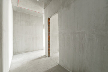 interior of the apartment without decoration in gray colors. rough finish
