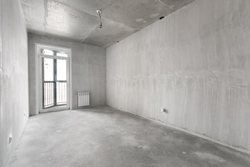interior of the apartment without decoration in gray colors. rough finish
