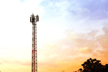 Obraz premium communication tower or 3G 4G network telephone cellsite with silhouette at sunset with space for text. Modern Business Communication Concept.Antenna.