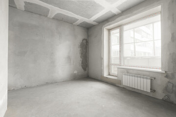 interior of the apartment without decoration in gray colors. rough finish