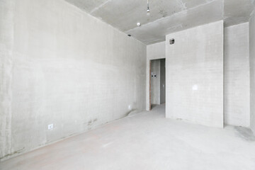 interior of the apartment without decoration in gray colors. rough finish