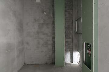 interior of the apartment without decoration in gray colors. rough finish