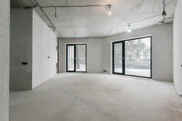 interior of the apartment without decoration in gray colors. rough finish