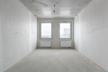 interior of the apartment without decoration in gray colors. rough finish
