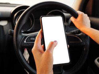 A woman who is using a phone while driving