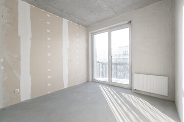 interior of the apartment without decoration in gray colors. rough finish