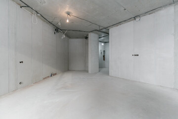 interior of the apartment without decoration in gray colors. rough finish