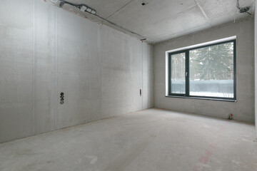 interior of the apartment without decoration in gray colors. rough finish