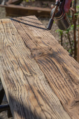 Obraz premium Texturing wood grain with blowtorch