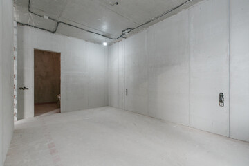interior of the apartment without decoration in gray colors. rough finish