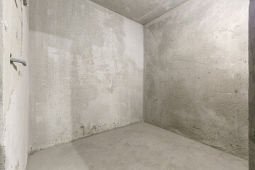 interior of the apartment without decoration in gray colors. rough finish