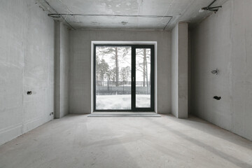 interior of the apartment without decoration in gray colors. rough finish