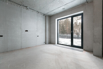 interior of the apartment without decoration in gray colors. rough finish