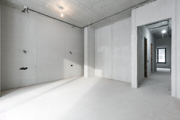 interior of the apartment without decoration in gray colors. rough finish