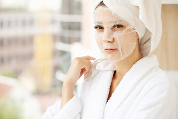Young beautiful woman in a face mask, skin care