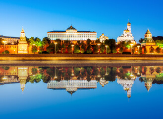 Fototapeta na wymiar Moscow Kremlin with cathedrals, towers and palaces at sunset reflected in Moskva river, Russia