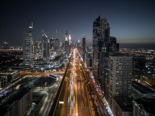 Aerial view of Sheikh Zayed road in Dubai city centre, a busy and large traffic road in Dubai downtown running among tall skyscrapers at night, Dubai, United Arab Emirates.