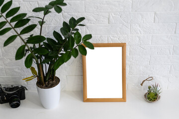 Mock up white frame on book shelf or desk. White colors.
