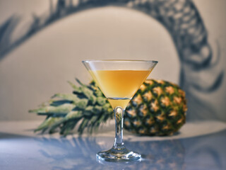 Pineapple juice (cocktail) and pineapple on the table