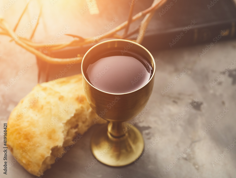 Wall mural chalice of wine and bread on grunge background