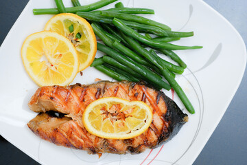 Grilled salmon steak with green beans