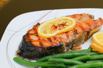 Grilled salmon steak with green beans