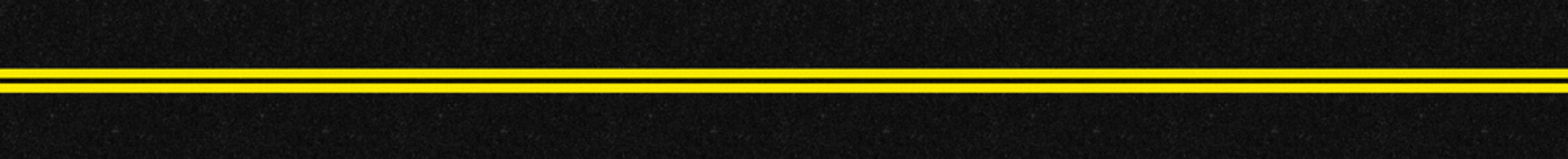 Fototapeta premium bandes jaunes doubles sur asphalte 