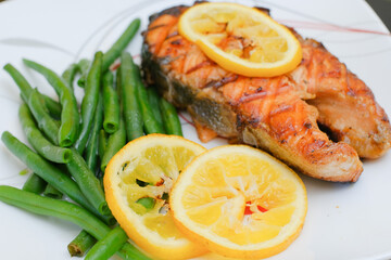 Grilled salmon steak with green beans