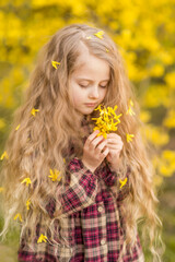 yellow flowers in the hands of a girl. Selective Focus