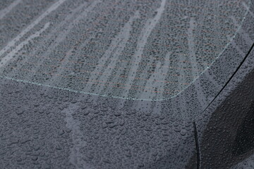 raindrops on a black car