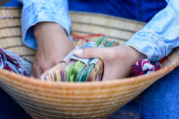 The Vietnamese money in woman's hands.