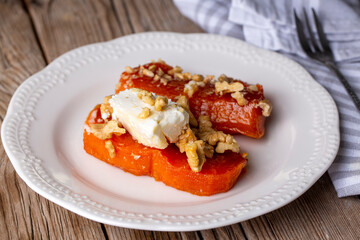Traditional Turkish Pumpkin Dessert with Cream Butter (Turkish name; Kaymakli bal kabagi tatlisi or kabak tatlisi)