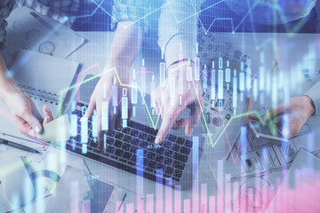 Double exposure of man and woman working together and forex graph hologram drawing. Financial analysis concept. Computer background. Top View.