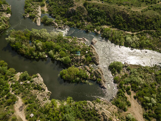 Fototapeta na wymiar Aerial rocky landscape on Southern Bug River with rapids. Ukraine