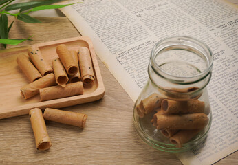 Thong Muan , Thai dessert, as a snack , On a wooden plate, made from flour, coconut milk, and eggs, in an atmosphere, vintage style.