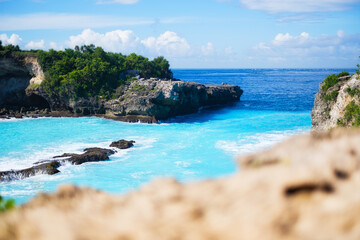 Seascape at the day time. Bay and rocks. Turquoise water background in the summer. Sea and beach. Nusa Penida, Bali, Indonesia. Travel and vacation image