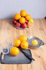 Manual juicer and fruits: oranges, apples. Healthy drinks