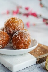 Chinese deep fried round Sugar Dnuts or Doughnuts on white background, selective focus