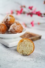 Chinese deep fried round Sugar Dnuts or Doughnuts on white background, selective focus