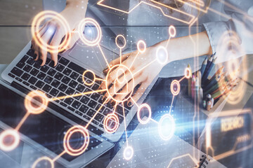 Double exposure of woman hands typing on computer and social network theme hologram drawing. People media concept.
