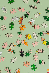 Puzzle pieces on green background
