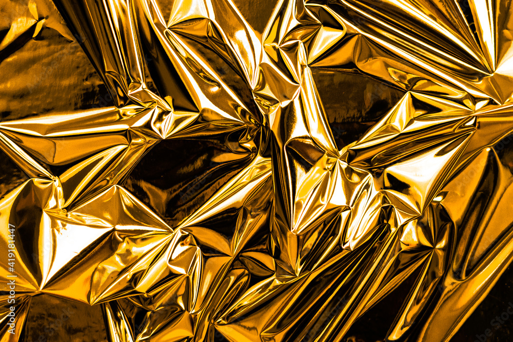 Poster crumpled gold abstract texture background. shining shimmering wallpaper for luxurious and glorious d