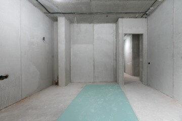 interior of the apartment without decoration in gray colors. rough finish