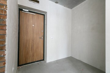 interior of the apartment without decoration in gray colors. rough finish