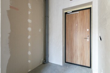 interior of the apartment without decoration in gray colors. rough finish