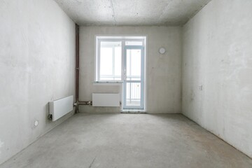 interior of the apartment without decoration in gray colors. rough finish