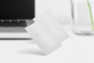 Clean minimal business card mockup on white desktop