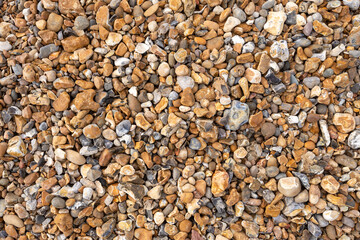 Different coloured pebbles on a beach