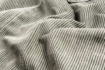clothing items stonewashed cotton fabric texture with seams, clasps, buttons and rivets, macro