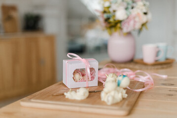 fancy cakes in a box on a wooden table edible toys